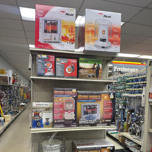 Floor heaters from brands like Hero World and KeroHeat, neatly arranged on a shelf in-store. Designed for efficient space heating with a compact and portable design.